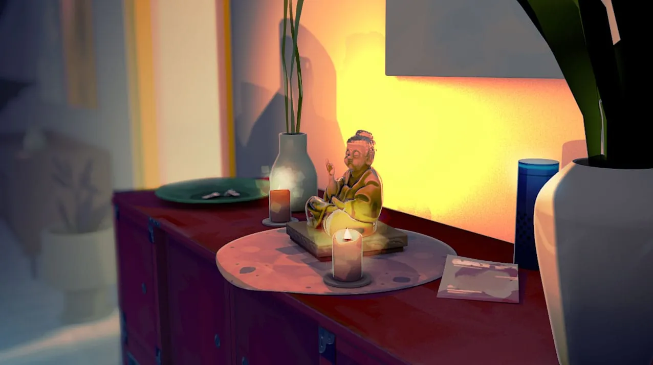 A figurine and a candle on a sideboard in warm light